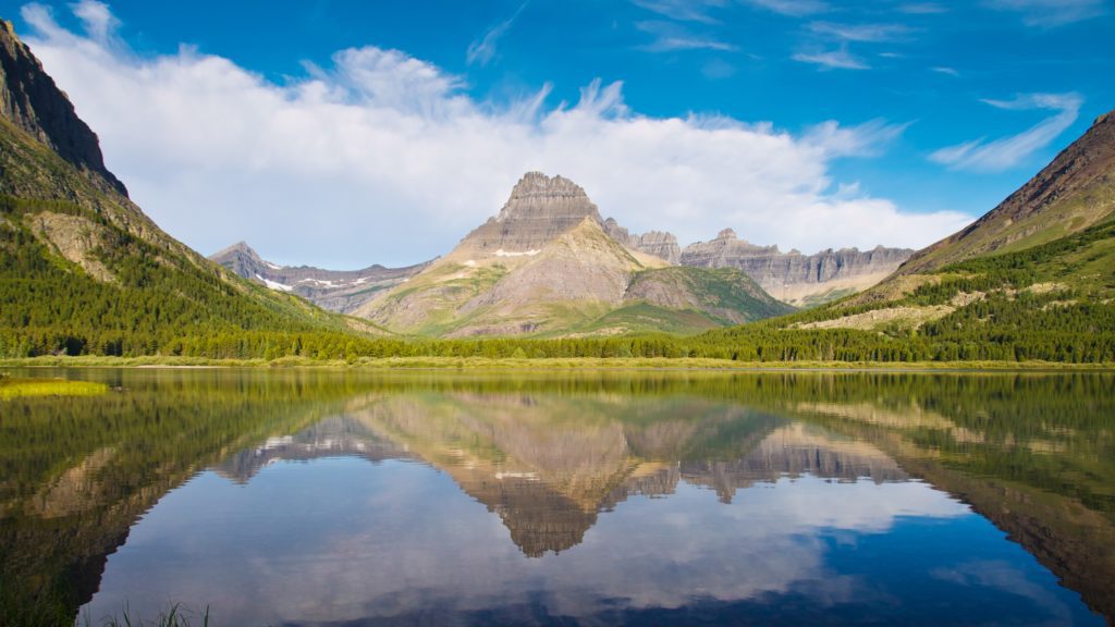 A photograph of Grinnell Point and Swiftcurrent Lake from the Many Glacier Hotel in Glacier National Park, Montana.
