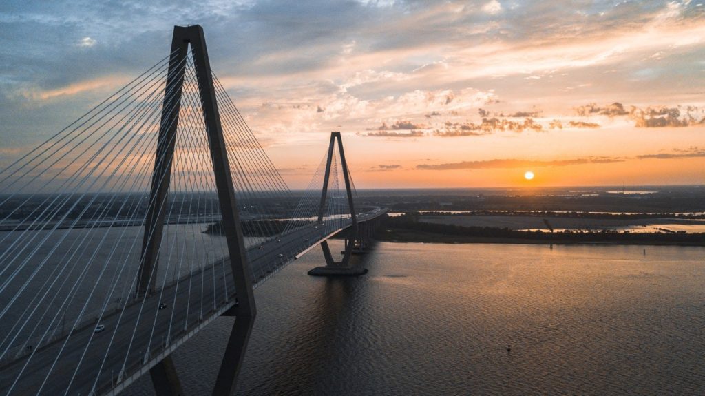 A picture of the Arthur Ravenel Jr. Bridge over the Cooper River in Mount Pleasant, South Carolina at sunset.