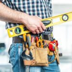 licensed contractor handyman holding tools