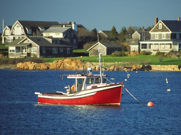 Red boat along Sakonnet River in Rhode Island